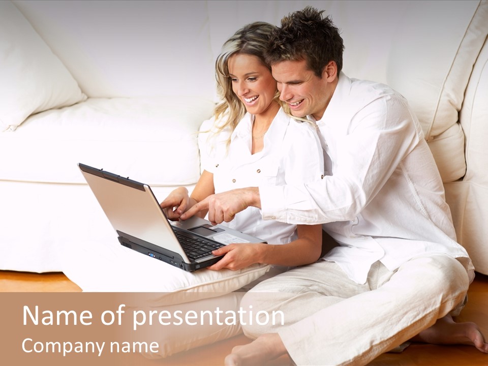 Young Love Couple Smiling In The Comfortable Apartment PowerPoint Template