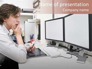 A Man Sitting At A Desk With A Computer PowerPoint Template