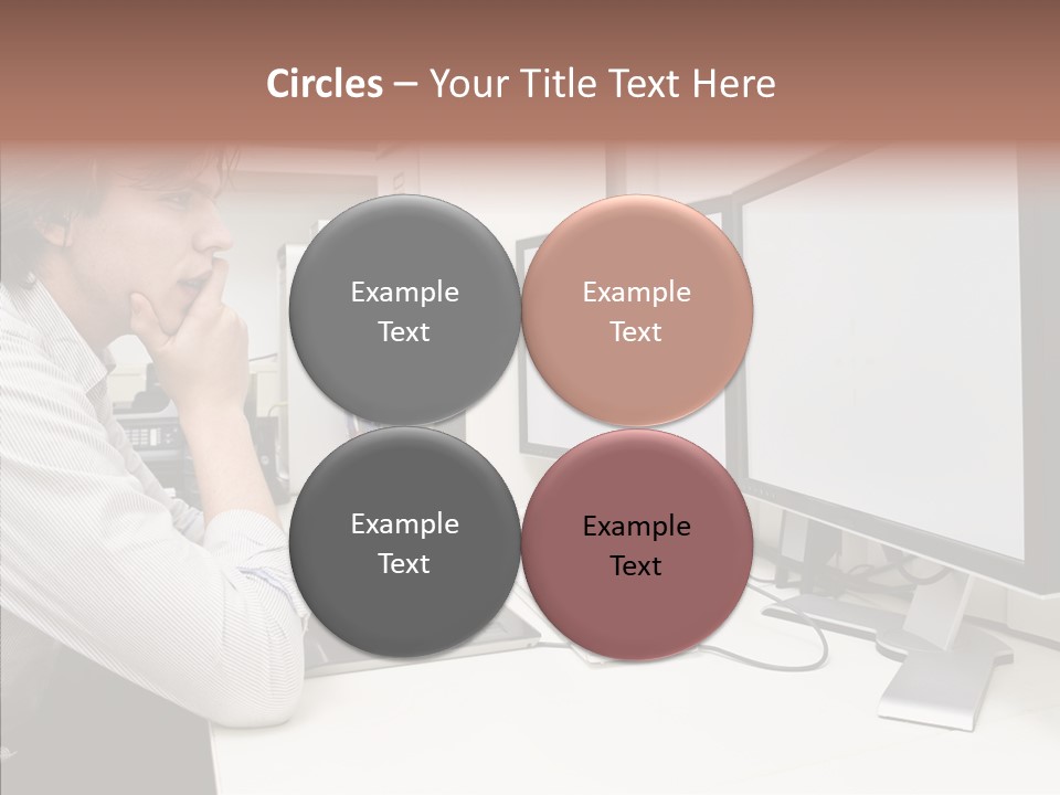 A Man Sitting At A Desk With A Computer PowerPoint Template