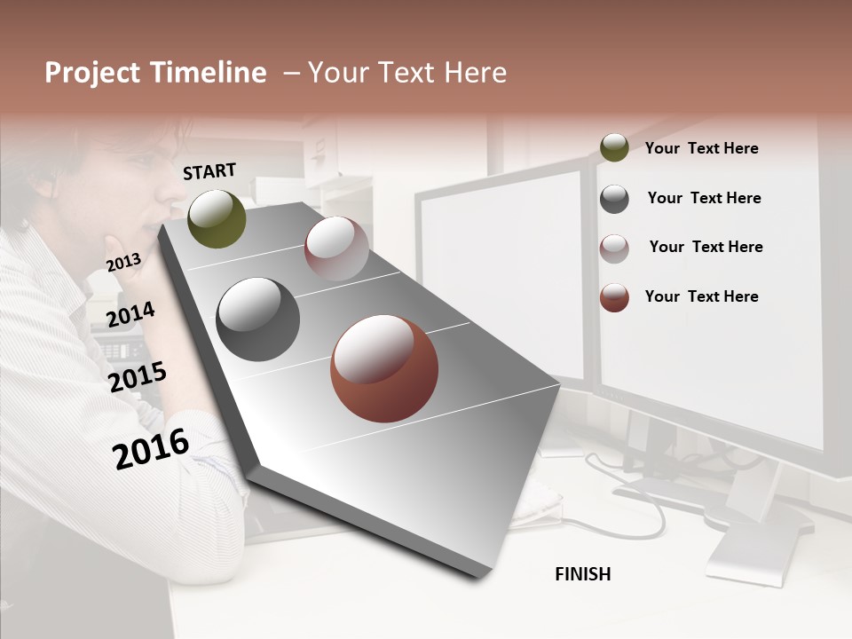 A Man Sitting At A Desk With A Computer PowerPoint Template