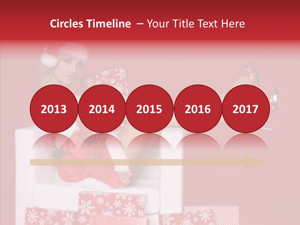 A Woman In A Santa Claus Outfit Sitting On A Chair PowerPoint Template