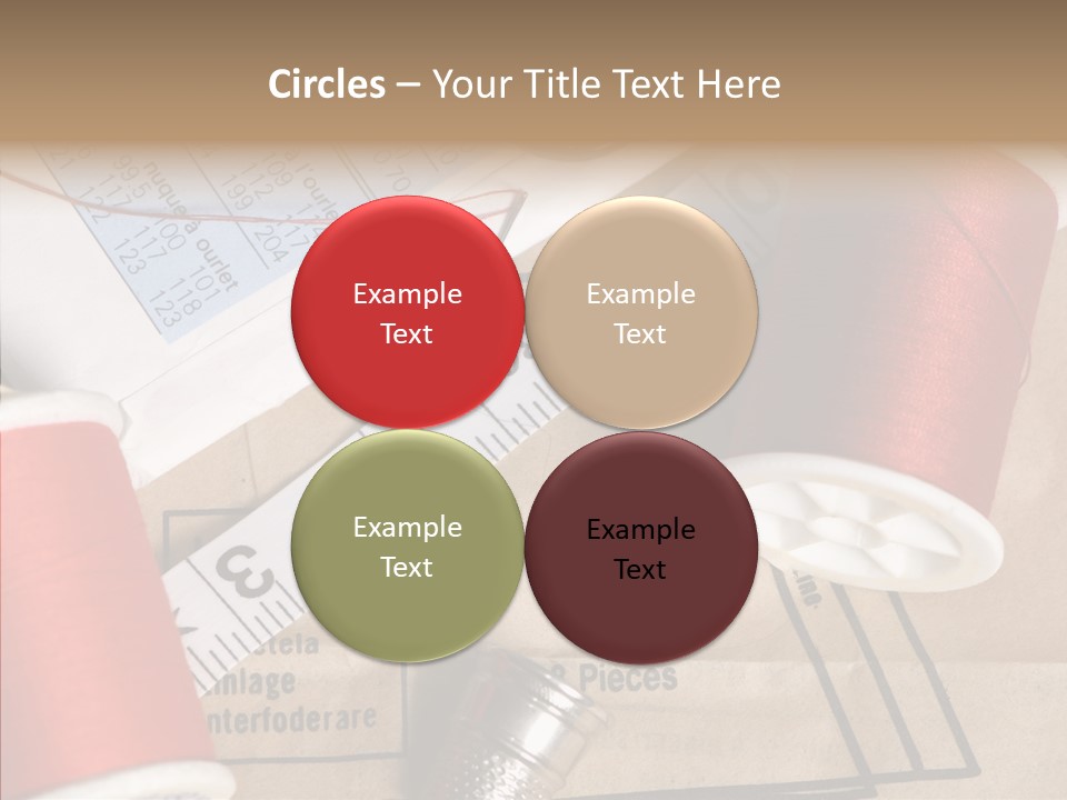 Two Spools Of Thread Sitting On Top Of A Piece Of Paper PowerPoint Template