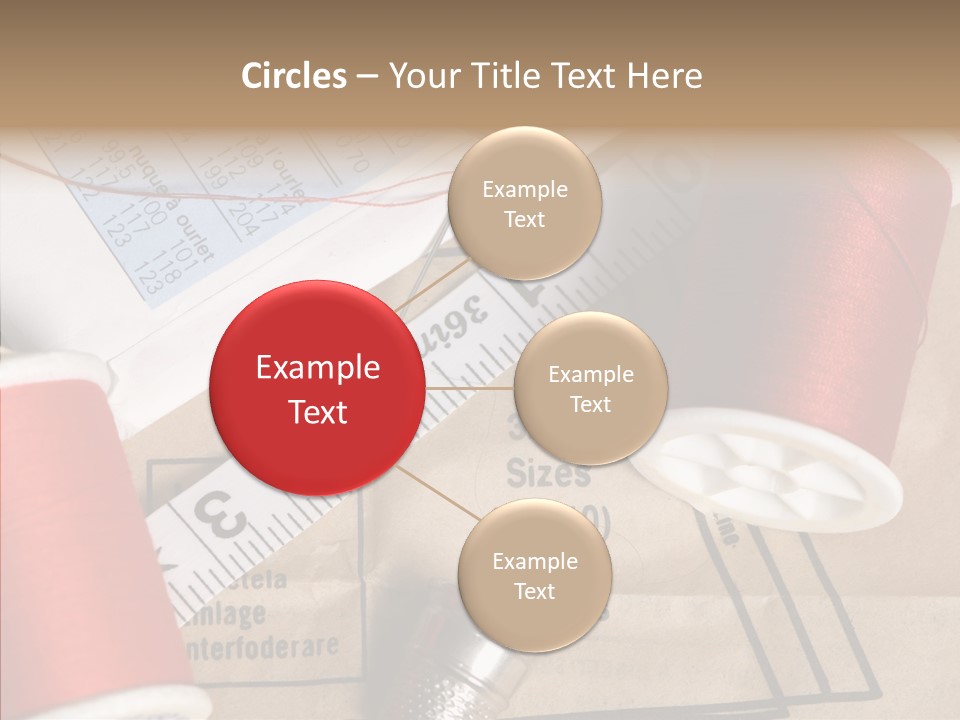 Two Spools Of Thread Sitting On Top Of A Piece Of Paper PowerPoint Template