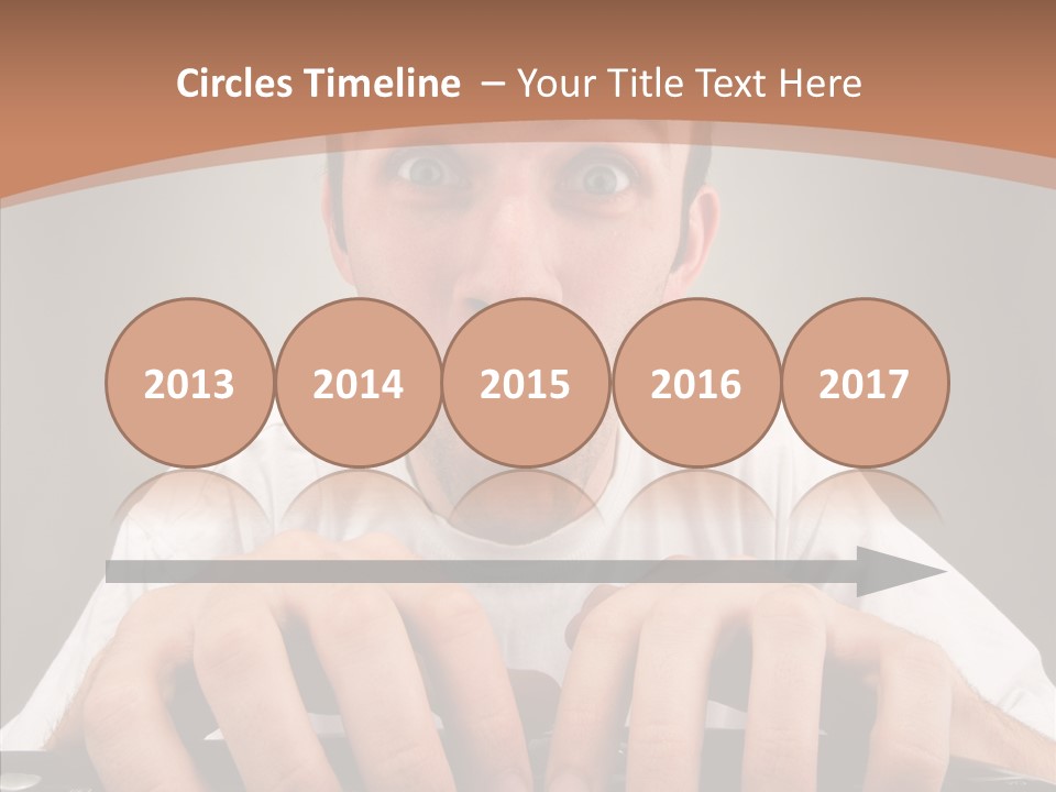 A Man With A Surprised Look On His Face Is Typing On A Keyboard PowerPoint Template