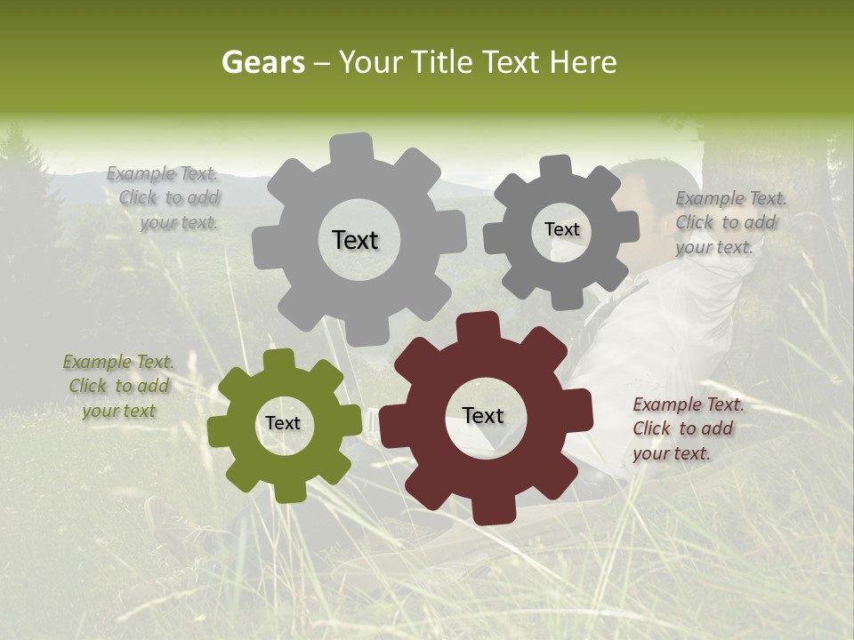 A Man Sitting In The Grass With A Laptop PowerPoint Template