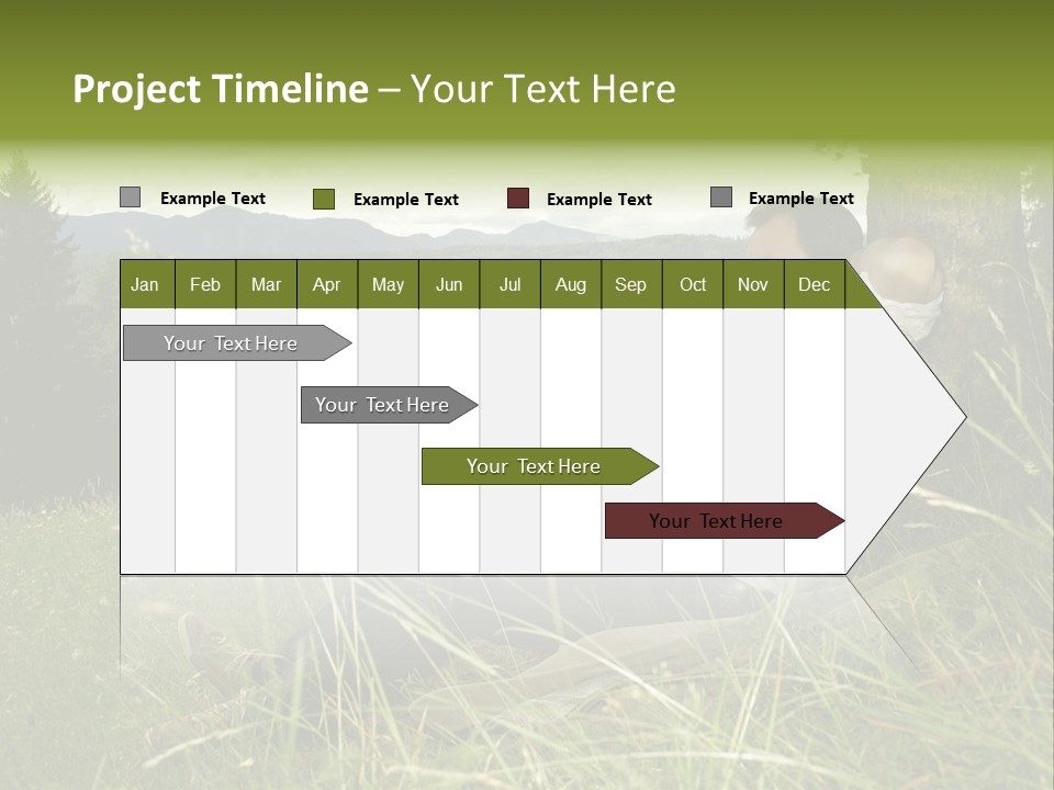 A Man Sitting In The Grass With A Laptop PowerPoint Template