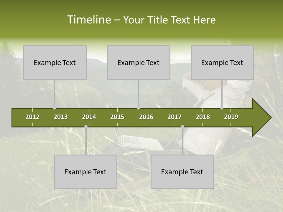 A Man Sitting In The Grass With A Laptop PowerPoint Template