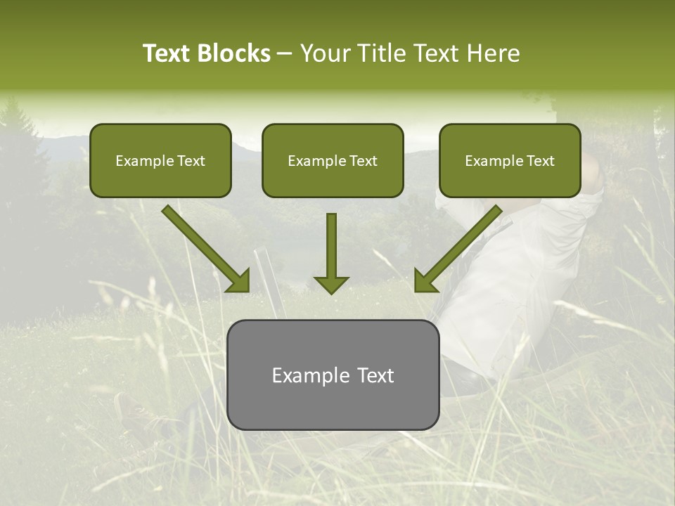A Man Sitting In The Grass With A Laptop PowerPoint Template
