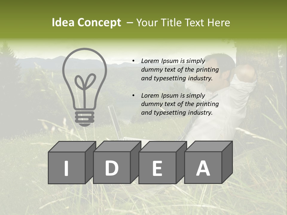 A Man Sitting In The Grass With A Laptop PowerPoint Template