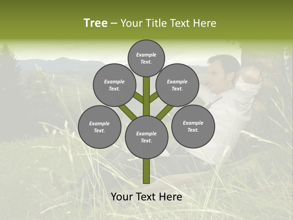 A Man Sitting In The Grass With A Laptop PowerPoint Template