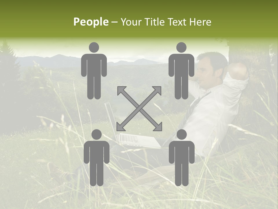 A Man Sitting In The Grass With A Laptop PowerPoint Template