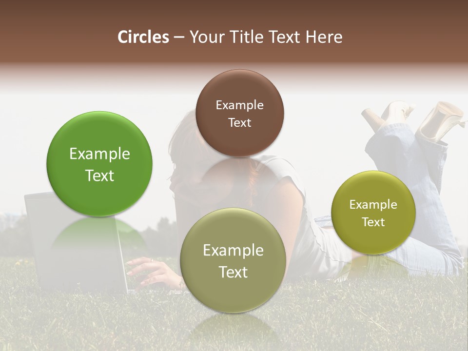 A Woman Laying On The Grass Using A Laptop PowerPoint Template