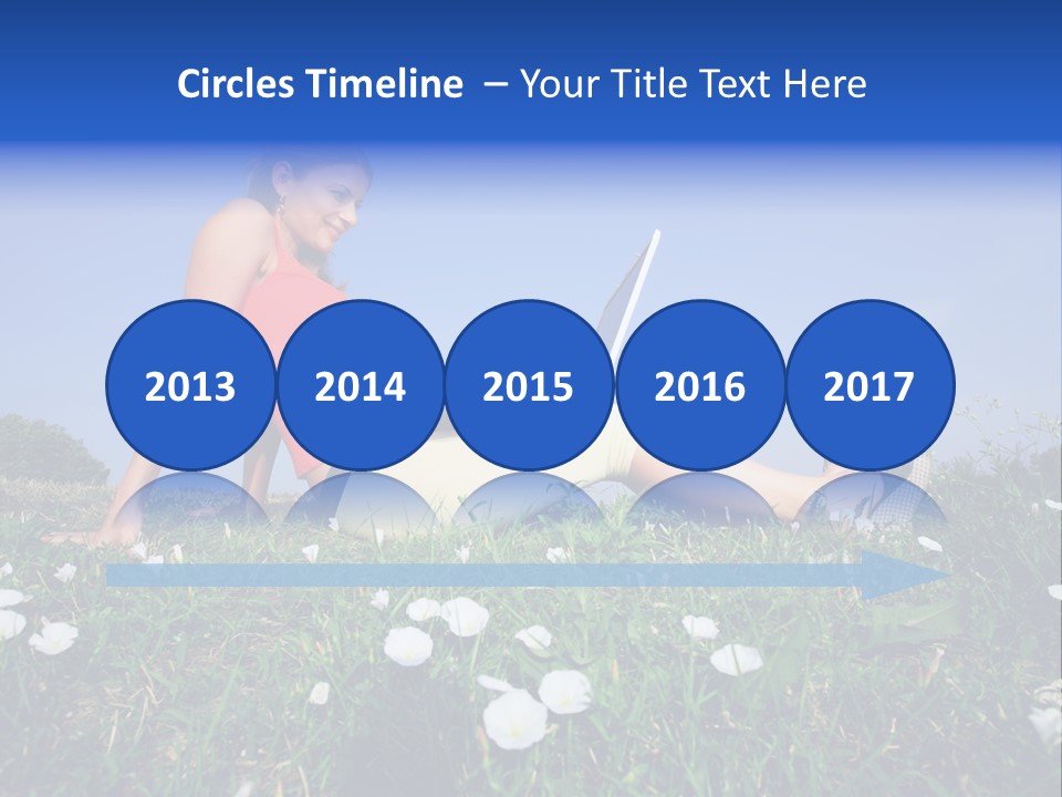 A Woman Laying On The Grass With A Laptop PowerPoint Template