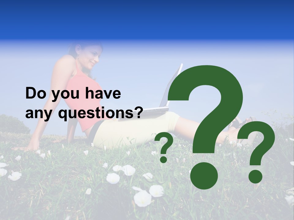 A Woman Laying On The Grass With A Laptop PowerPoint Template