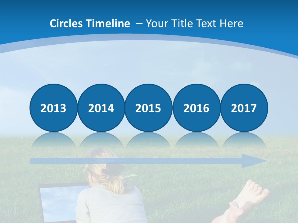 A Woman Laying In The Grass With A Laptop On Her Lap PowerPoint Template