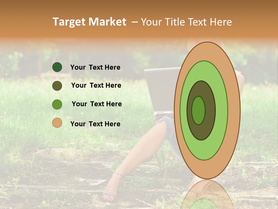A Woman Sitting In The Grass Using A Laptop Computer PowerPoint Template
