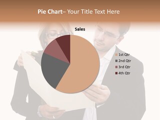 A Man And Woman Looking At A Piece Of Paper PowerPoint Template