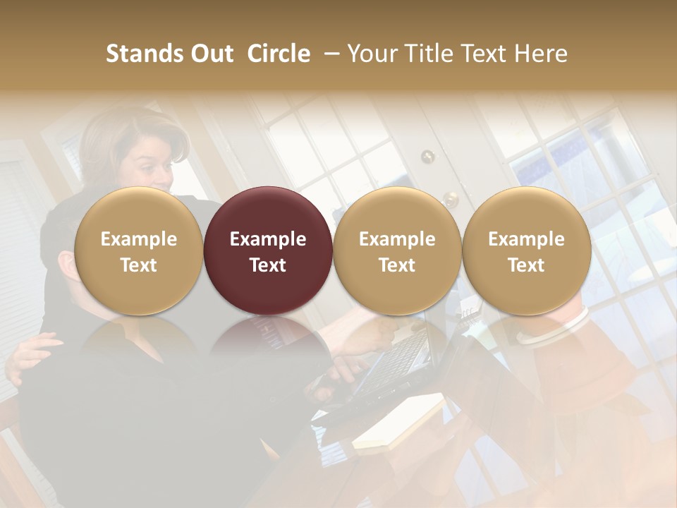 A Man And Woman Sitting At A Table With A Laptop PowerPoint Template