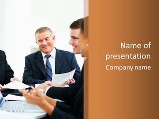 A Group Of Business People Sitting Around A Table PowerPoint Template