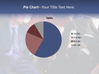 A Group Of People Sitting Around A Table PowerPoint Template