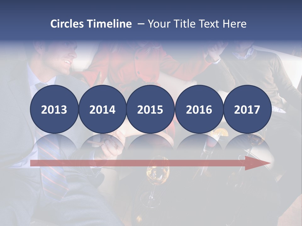 A Group Of People Sitting Around A Table PowerPoint Template