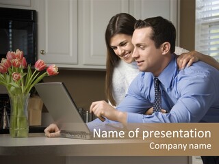 A Man And Woman Looking At A Laptop Screen PowerPoint Template