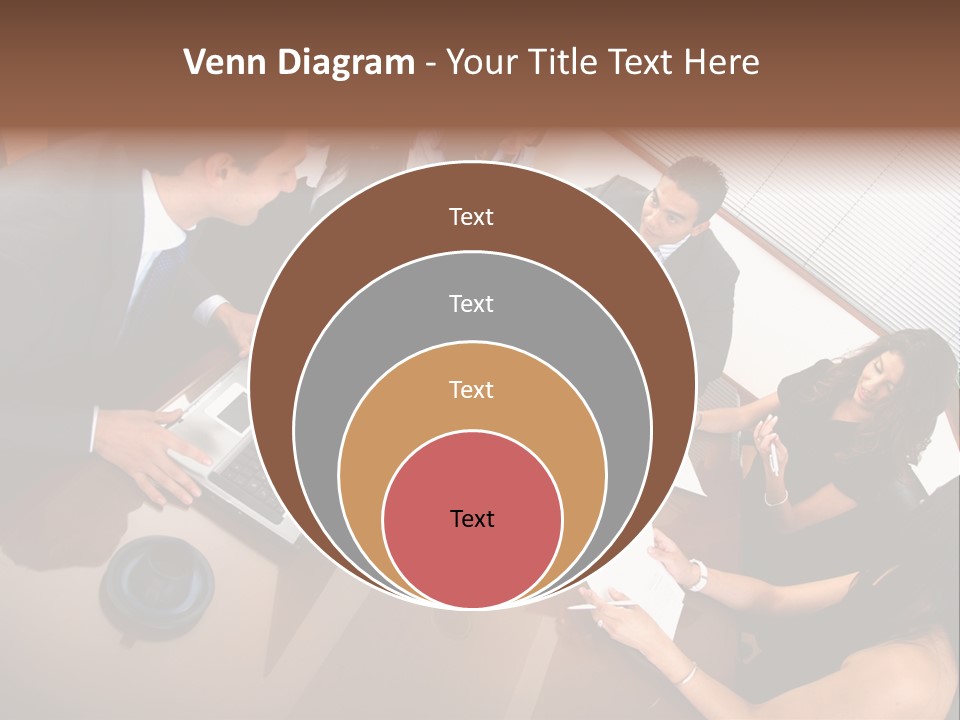 A Group Of People Sitting Around A Conference Table PowerPoint Template