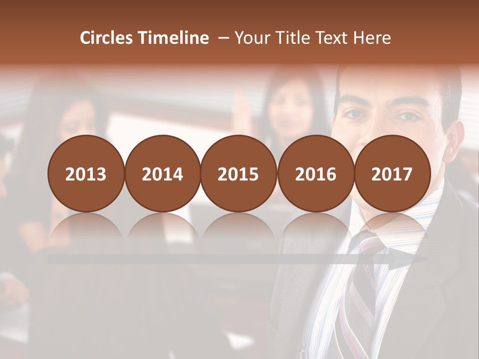 A Man In A Suit And Tie Standing In Front Of A Group Of People PowerPoint Template