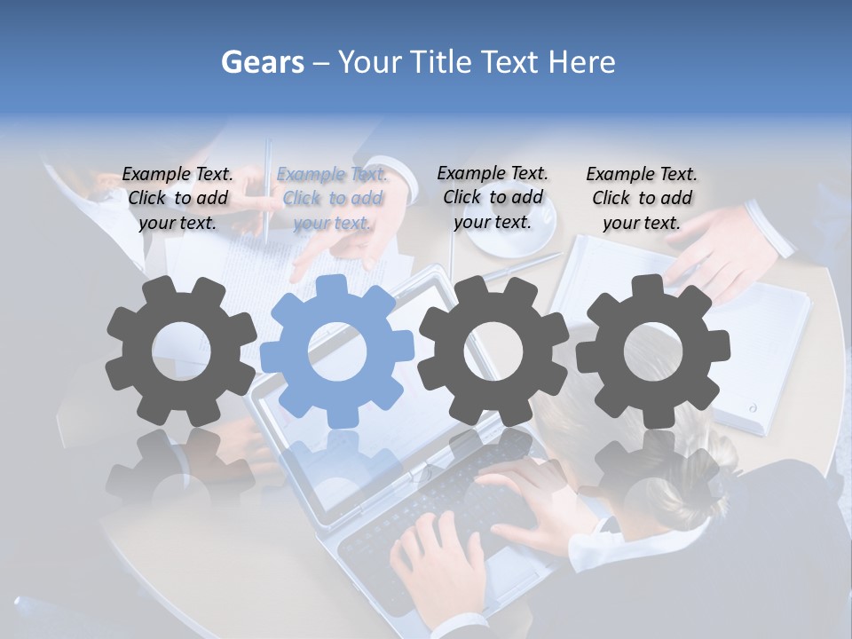 A Group Of People Sitting Around A Table Working On Laptops PowerPoint Template