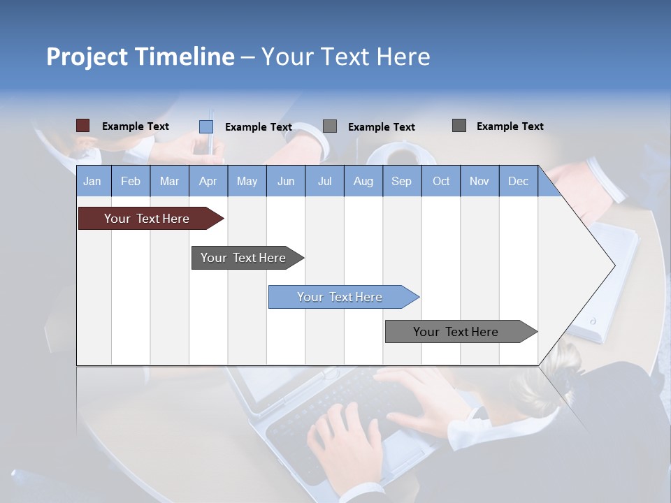 A Group Of People Sitting Around A Table Working On Laptops PowerPoint Template