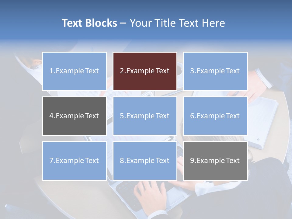 A Group Of People Sitting Around A Table Working On Laptops PowerPoint Template