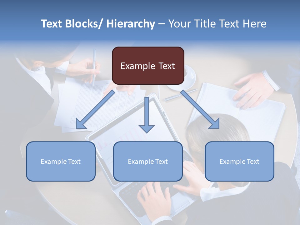 A Group Of People Sitting Around A Table Working On Laptops PowerPoint Template