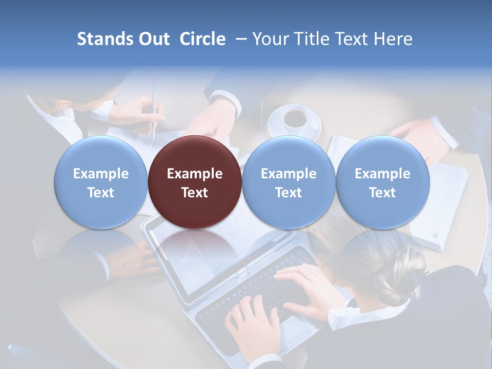 A Group Of People Sitting Around A Table Working On Laptops PowerPoint Template