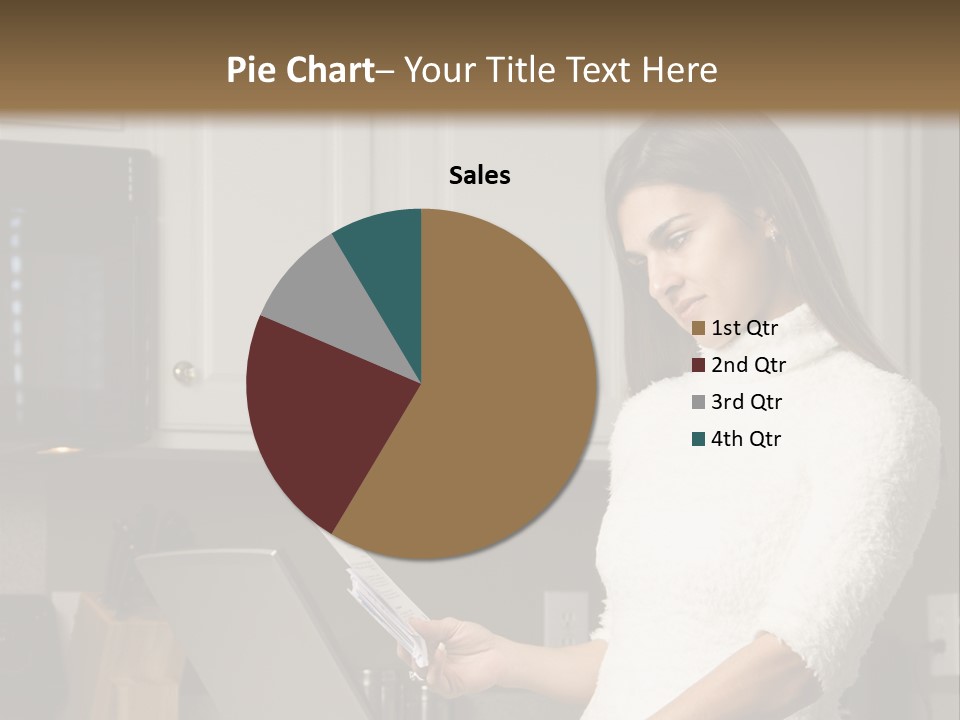 A Woman Using A Laptop Computer In A Kitchen PowerPoint Template
