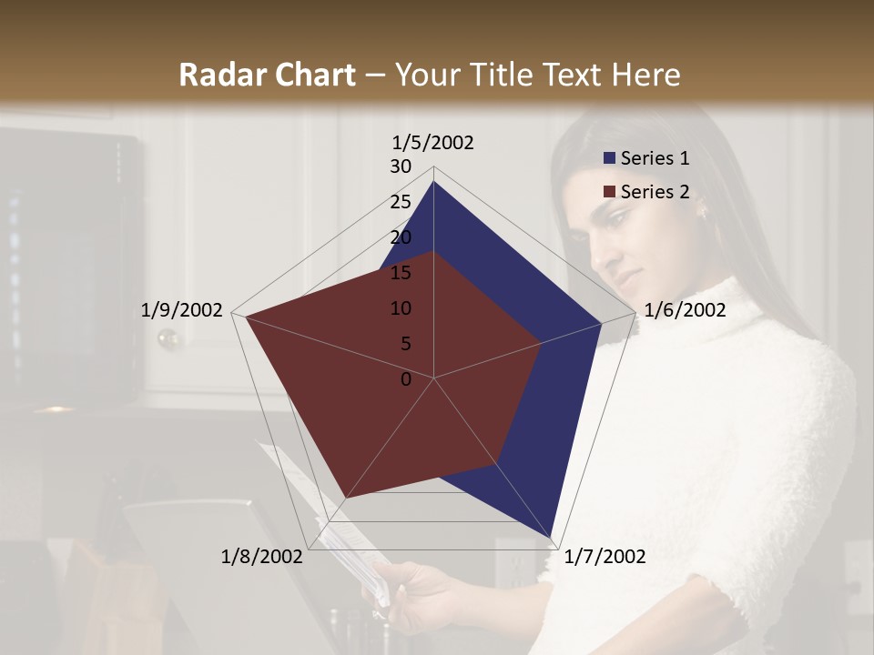 A Woman Using A Laptop Computer In A Kitchen PowerPoint Template