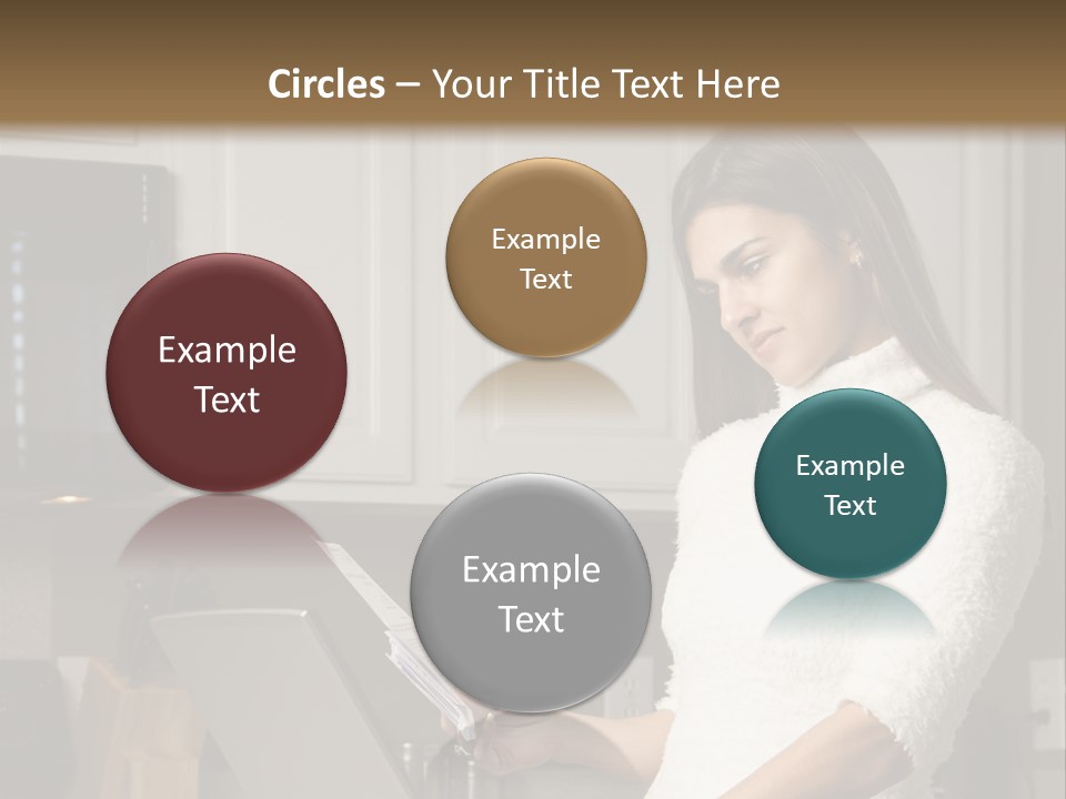 A Woman Using A Laptop Computer In A Kitchen PowerPoint Template