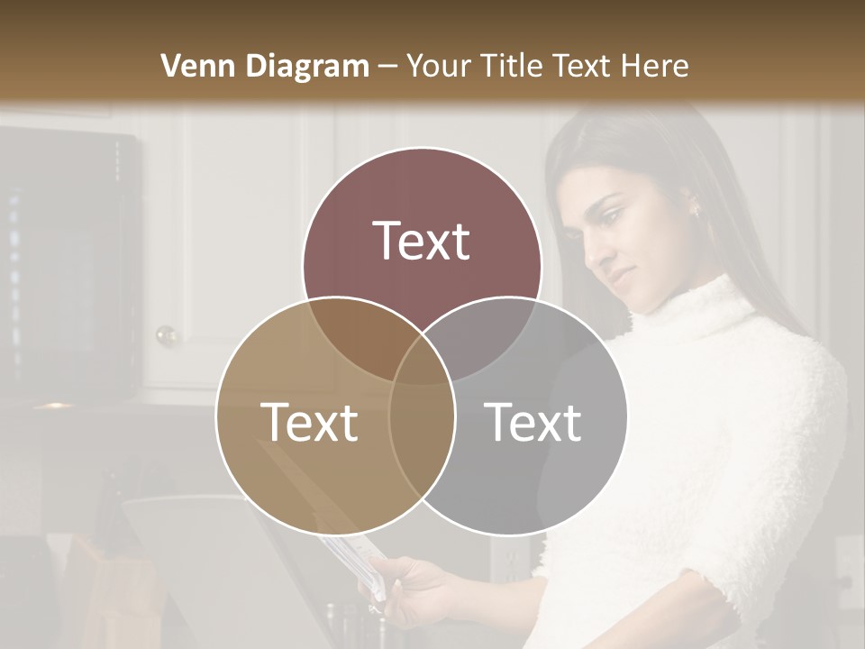 A Woman Using A Laptop Computer In A Kitchen PowerPoint Template