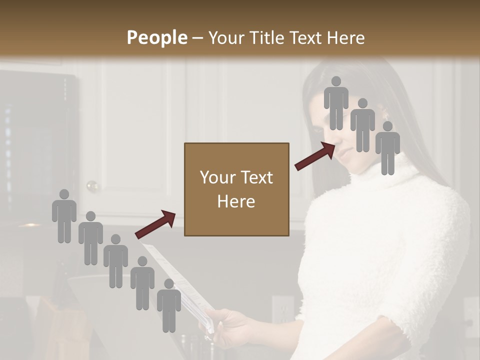 A Woman Using A Laptop Computer In A Kitchen PowerPoint Template