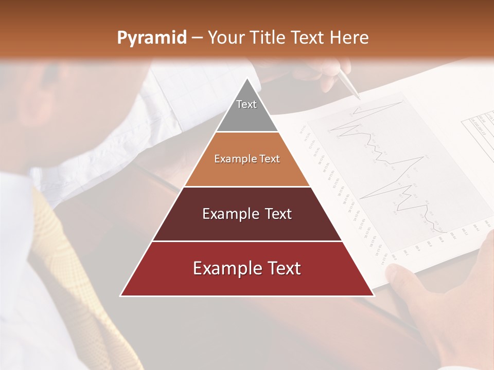 A Man Sitting At A Desk Writing On A Piece Of Paper PowerPoint Template