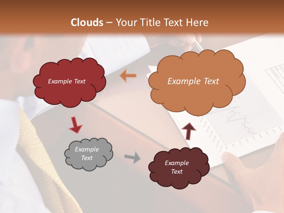 A Man Sitting At A Desk Writing On A Piece Of Paper PowerPoint Template
