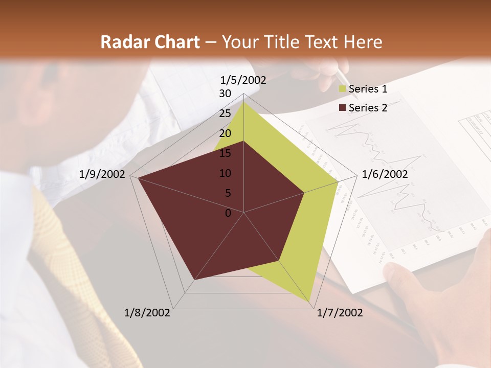 A Man Sitting At A Desk Writing On A Piece Of Paper PowerPoint Template