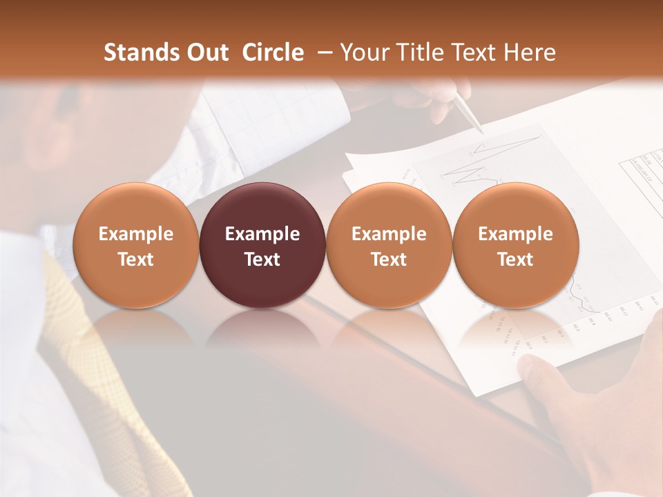 A Man Sitting At A Desk Writing On A Piece Of Paper PowerPoint Template