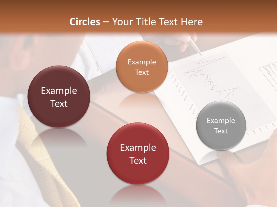 A Man Sitting At A Desk Writing On A Piece Of Paper PowerPoint Template