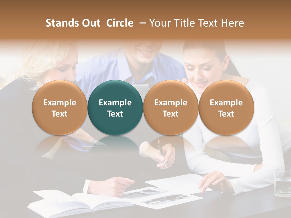 A Group Of People Sitting Around A Table With A Laptop PowerPoint Template