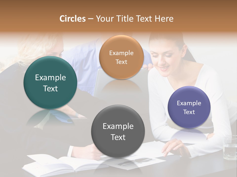 A Group Of People Sitting Around A Table With A Laptop PowerPoint Template