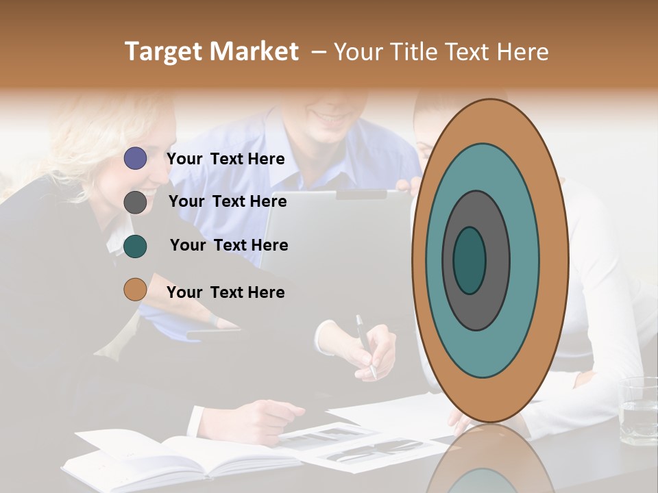 A Group Of People Sitting Around A Table With A Laptop PowerPoint Template