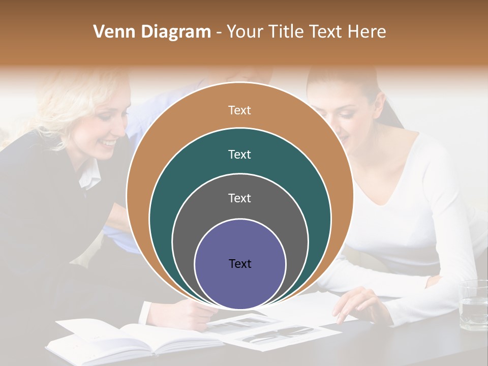 A Group Of People Sitting Around A Table With A Laptop PowerPoint Template