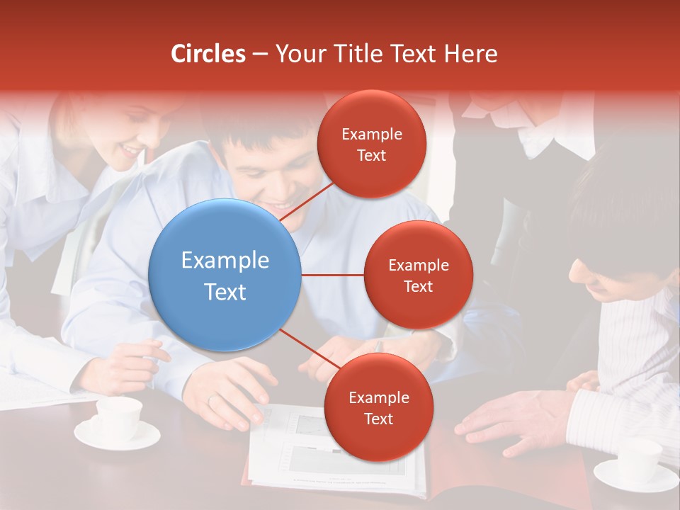 A Group Of People Sitting Around A Table Working On A Piece Of Paper PowerPoint Template