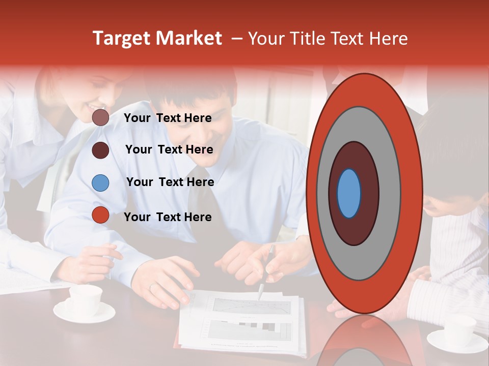 A Group Of People Sitting Around A Table Working On A Piece Of Paper PowerPoint Template