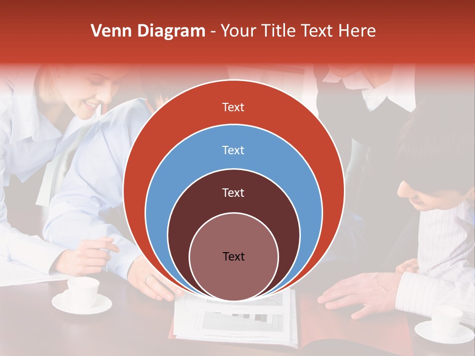 A Group Of People Sitting Around A Table Working On A Piece Of Paper PowerPoint Template